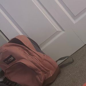 a backpack trans jansport many zippers had it for a while but  used once